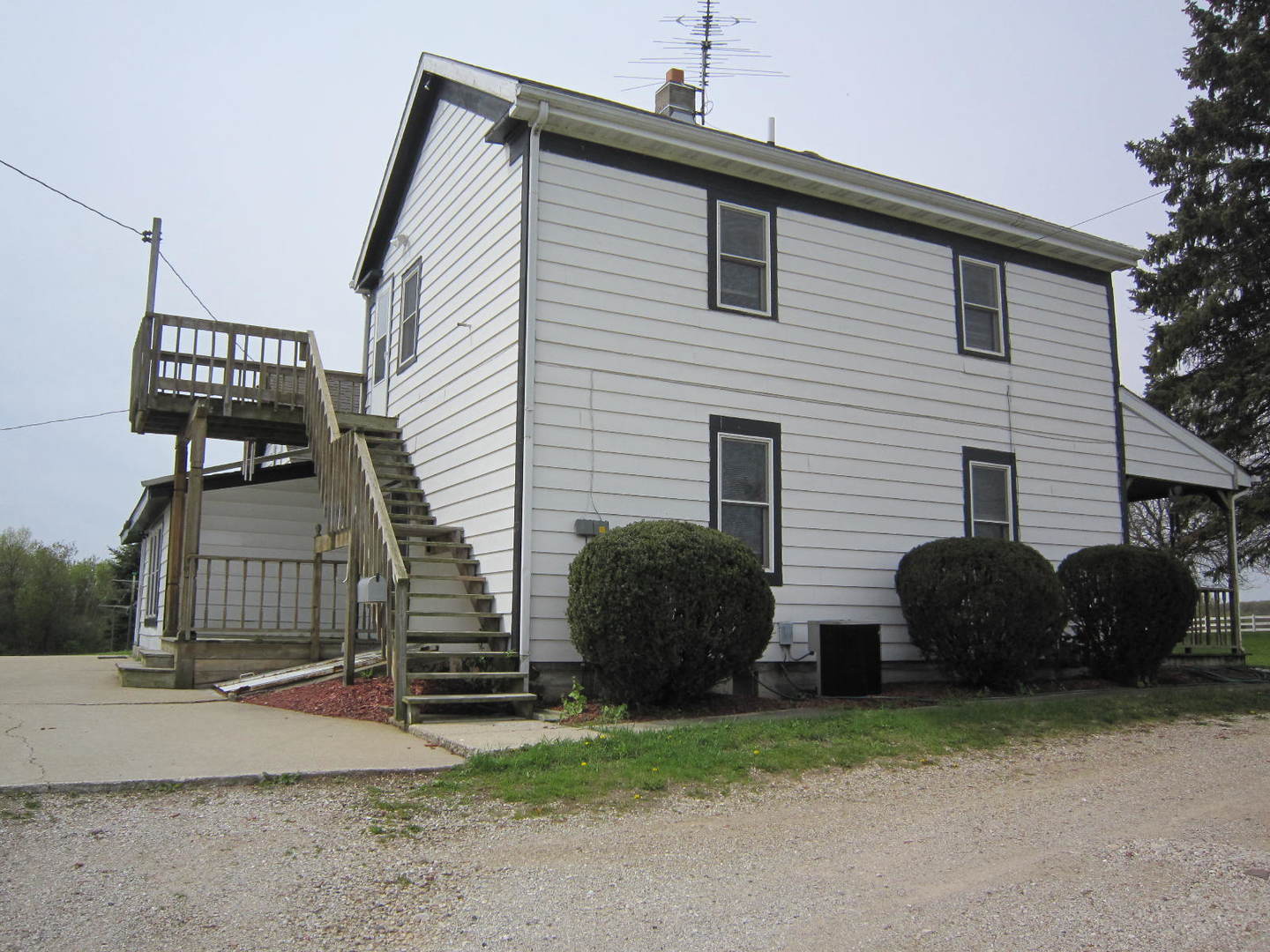 12701 304th Avenue, Unit 2 Trevor, WI 53179 - Photo 2 of 10 a front view of a house with garage
