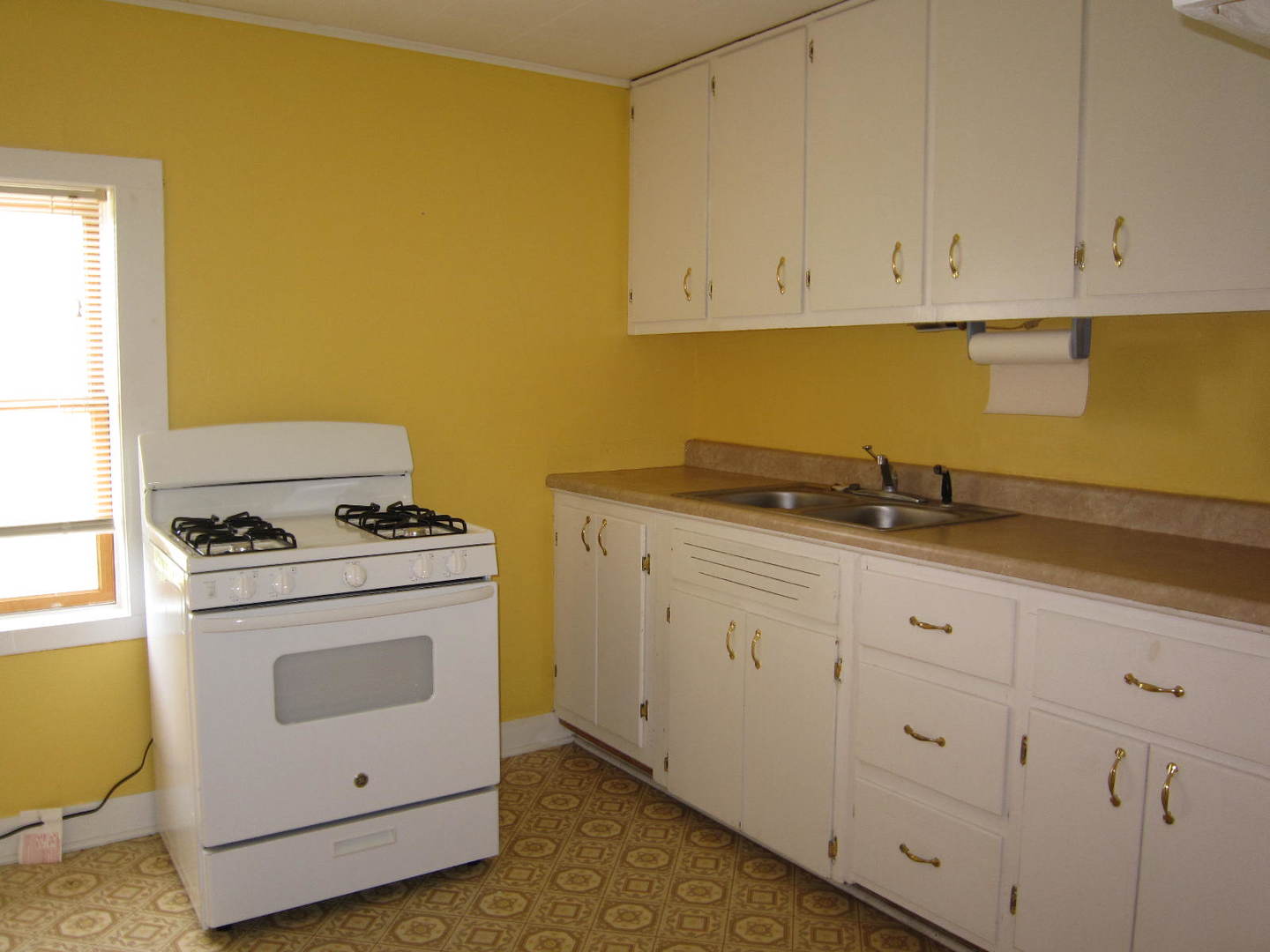 12701 304th Avenue, Unit 2 Trevor, WI 53179 - Photo 5 of 10 a white stove top oven sitting inside of a kitchen