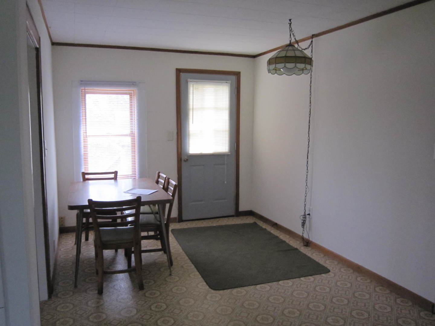12701 304th Avenue, Unit 2 Trevor, WI 53179 - Photo 7 of 10 a view of a room that has a table and chair