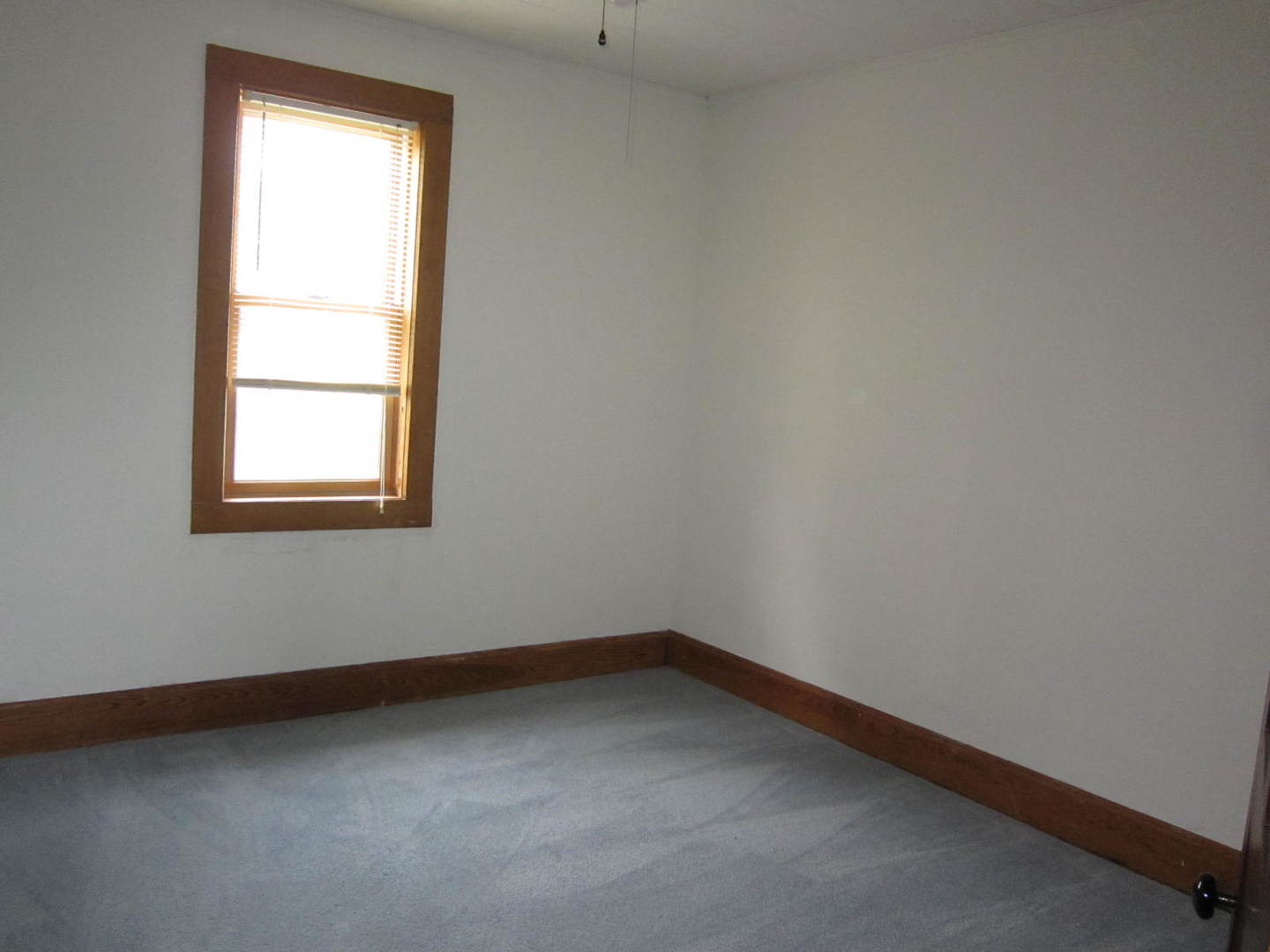 12701 304th Avenue, Unit 2 Trevor, WI 53179 - Photo 9 of 10 an empty room with a window