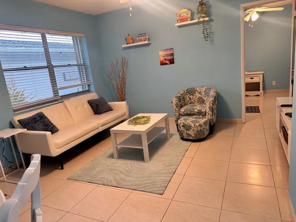 a living room with furniture and a window