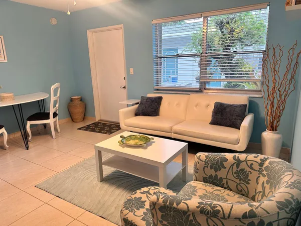 a living room with furniture and a window