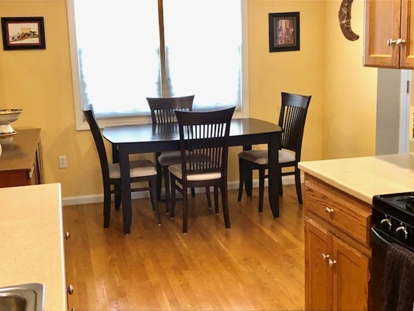 113 Ariel Circle, Unit 113 Sutton, MA 01590 - Photo 12 of 39 a view of a dining room with furniture