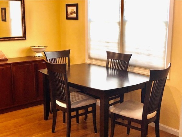 113 Ariel Circle, Unit 113 Sutton, MA 01590 - Photo 13 of 39 a view of a dining room with furniture and window