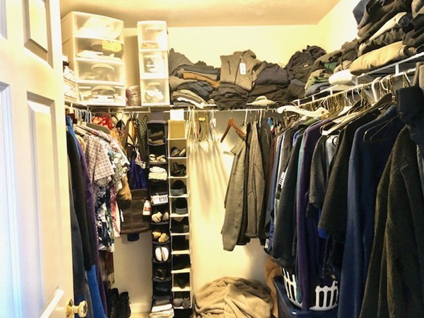 113 Ariel Circle, Unit 113 Sutton, MA 01590 - Photo 23 of 39 a view of walk in closet with clothes and shoes
