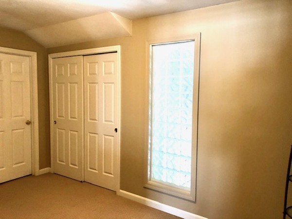 113 Ariel Circle, Unit 113 Sutton, MA 01590 - Photo 28 of 39 an empty room with windows