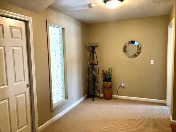 113 Ariel Circle, Unit 113 Sutton, MA 01590 - Photo 29 of 39 a view of a room with gym equipment