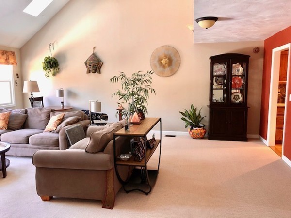 113 Ariel Circle, Unit 113 Sutton, MA 01590 - Photo 5 of 39 a living room with furniture and a large window
