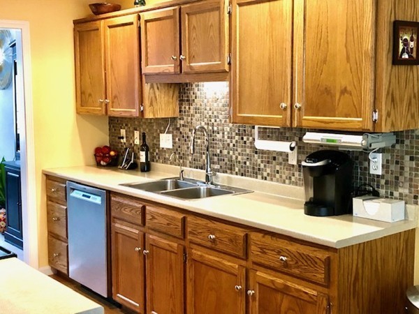 113 Ariel Circle, Unit 113 Sutton, MA 01590 - Photo 10 of 39 a kitchen with a sink a window and cabinets