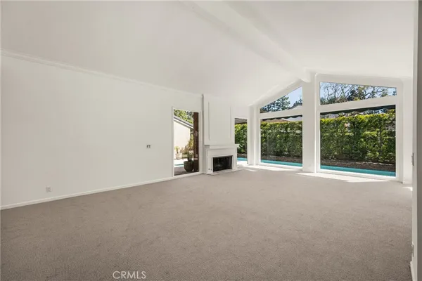 a view of an empty room with balcony