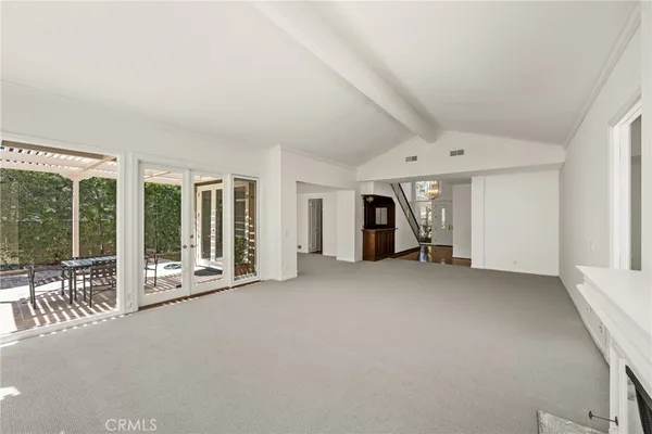 a view of a hallway with entryway door