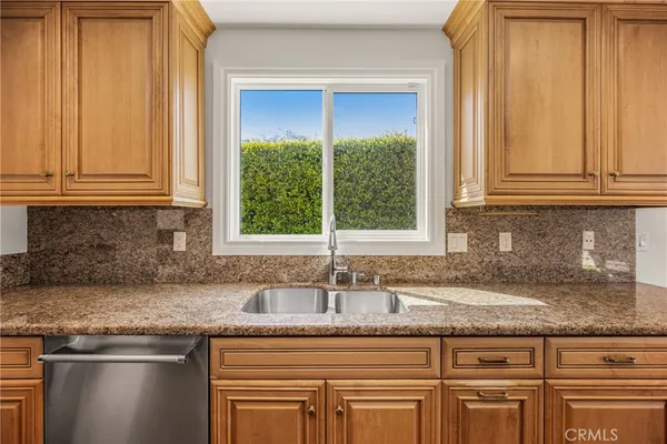 a view of a hallway with wooden floor and a living room