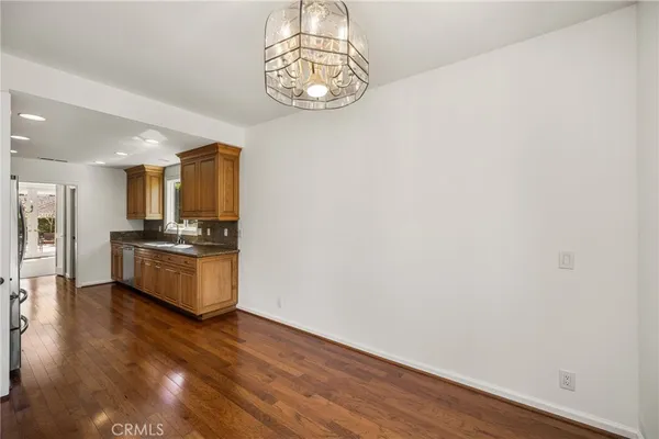 a view of an empty room with windows