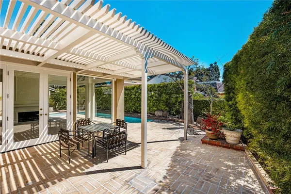 a view of backyard with plants and outdoor seating
