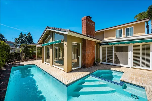a bathroom with a double vanity sink a mirror and a shower