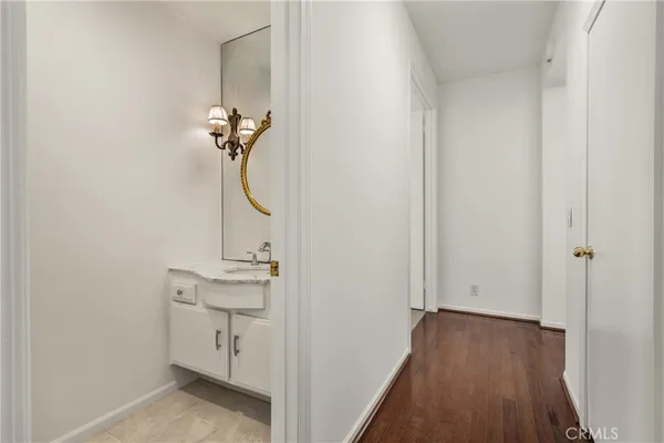 an empty room with closet and windows