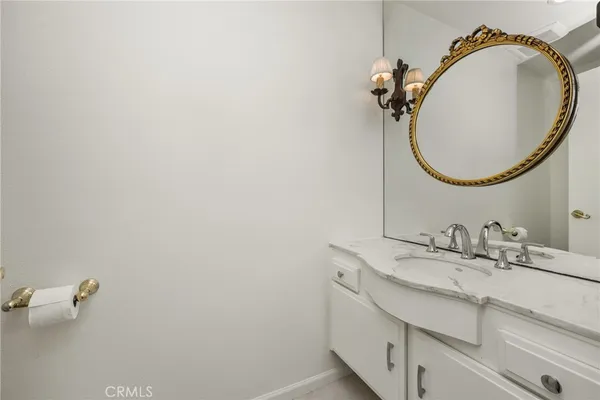 a bathroom with a double vanity sink and mirror