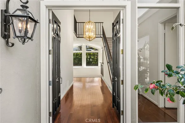a view of an entryway with wooden floor