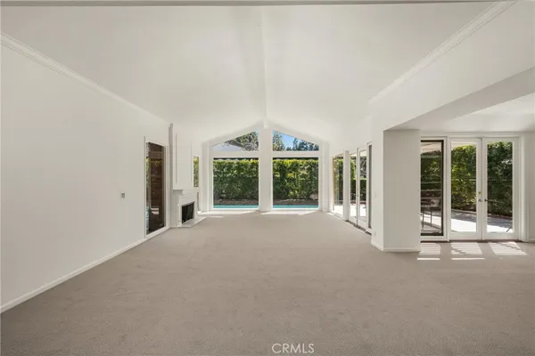 a view of an empty room with a fireplace