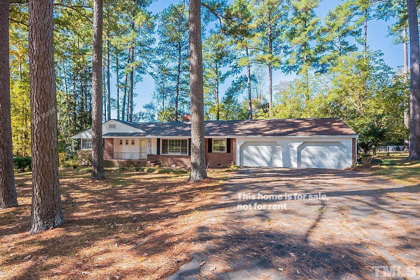 116 Ridge Road Butner, NC 27509 - Photo 1 of 16 a view of a house with yard and sitting area
