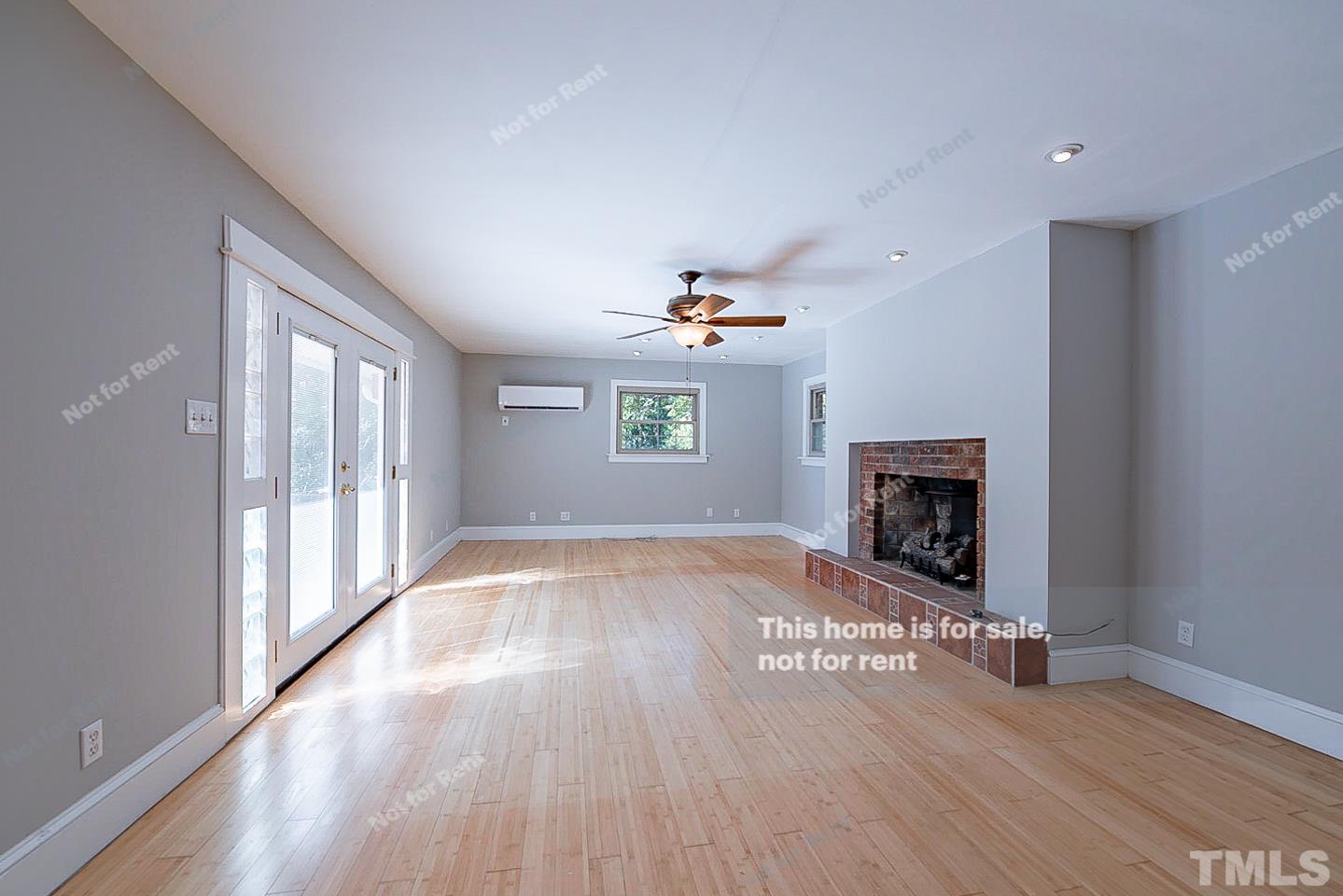 116 Ridge Road Butner, NC 27509 - Photo 11 of 16 a view of an empty room with a window and fireplace