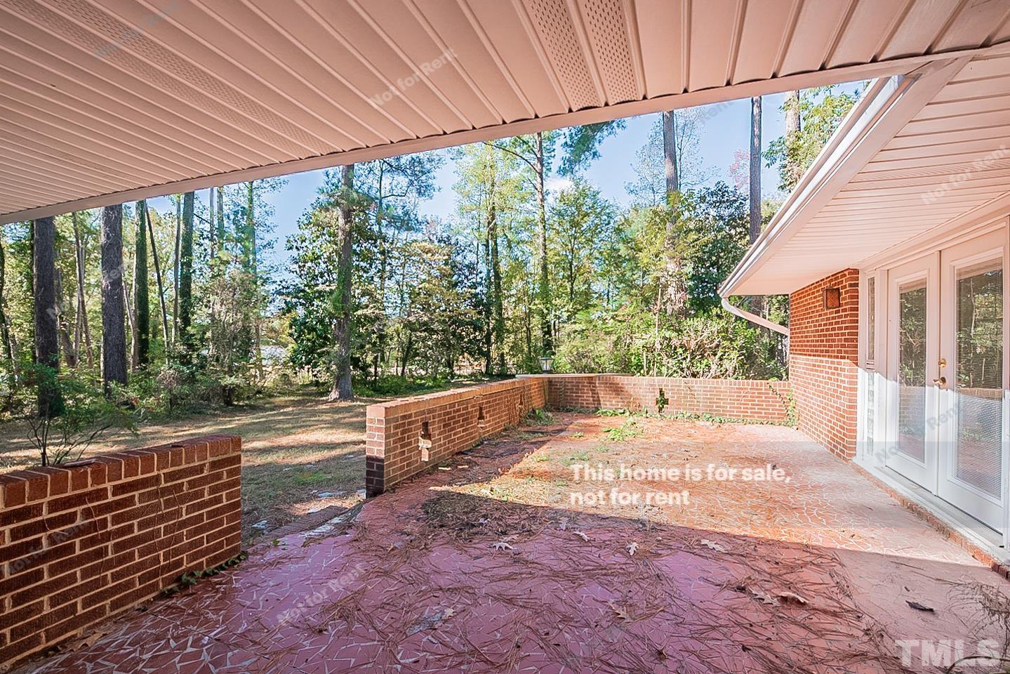 116 Ridge Road Butner, NC 27509 - Photo 13 of 16 a view of a house with backyard and sitting area