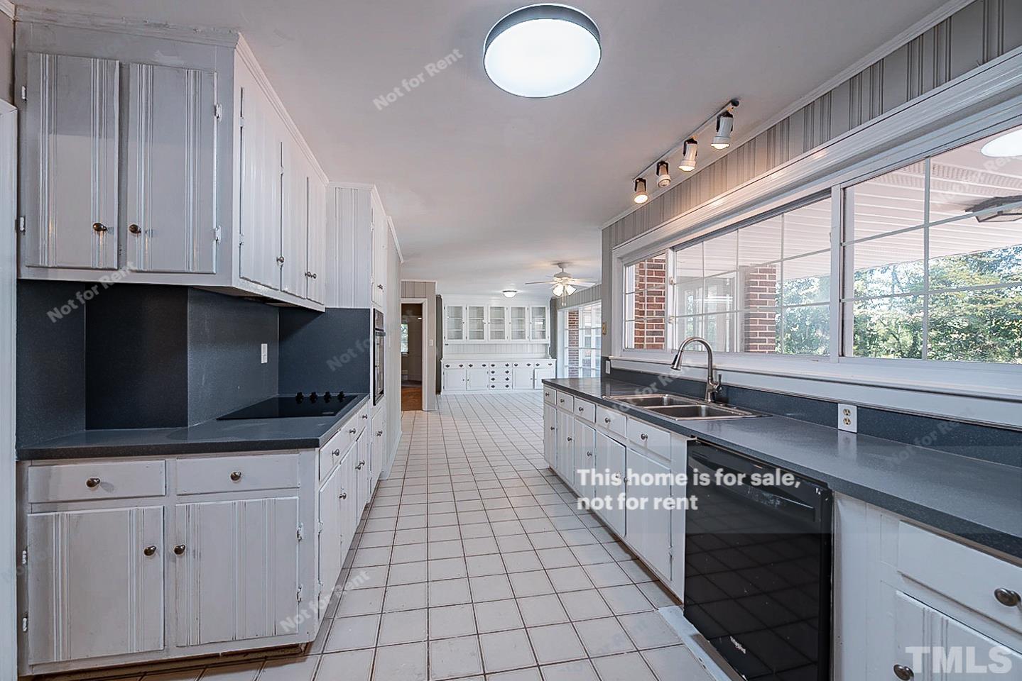 116 Ridge Road Butner, NC 27509 - Photo 4 of 16 a large kitchen with cabinets