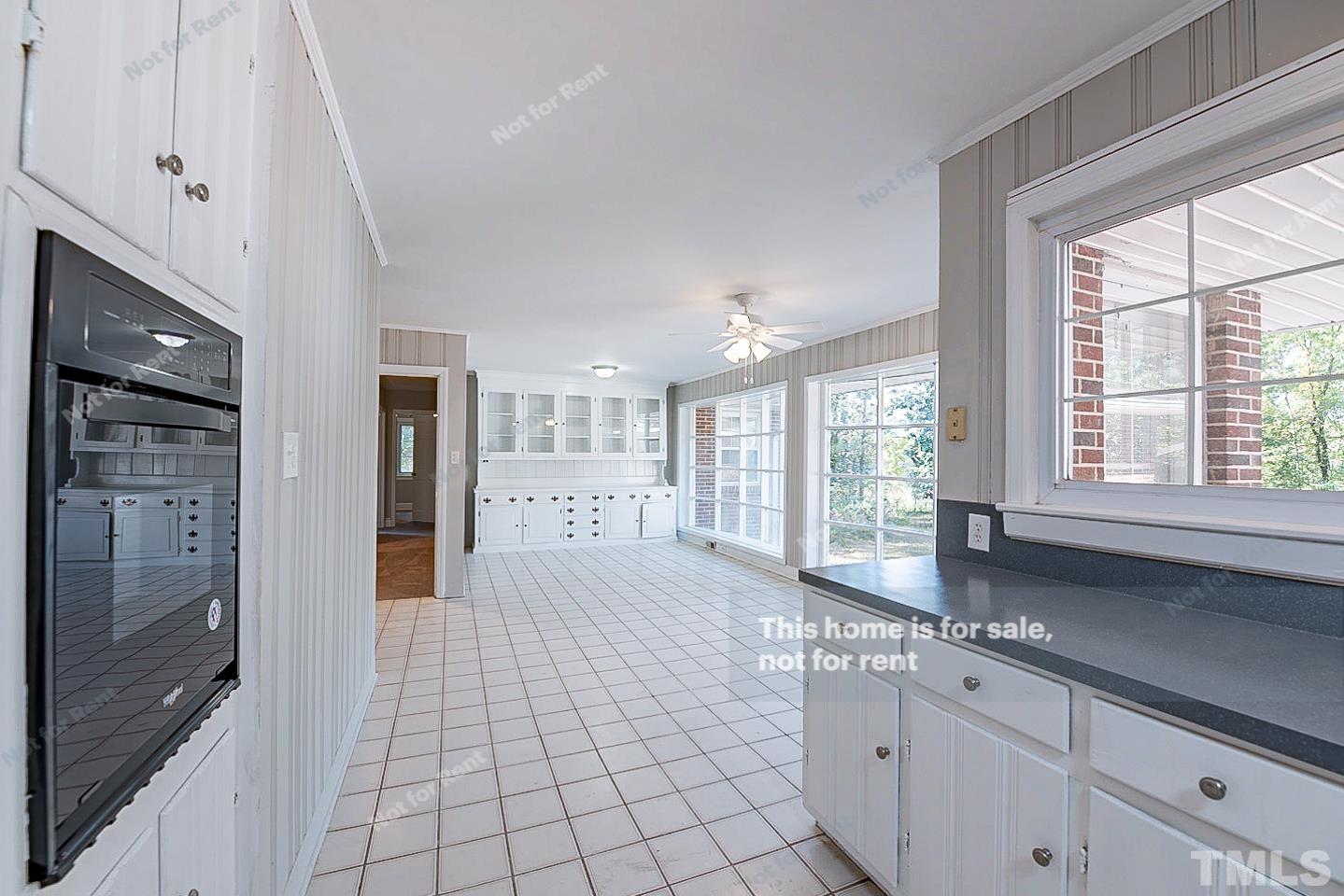 116 Ridge Road Butner, NC 27509 - Photo 6 of 16 a large en suite bathroom with a granite countertop double vanity shower and a large window