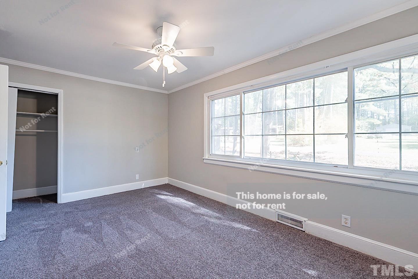 116 Ridge Road Butner, NC 27509 - Photo 8 of 16 a view of an empty room with a window