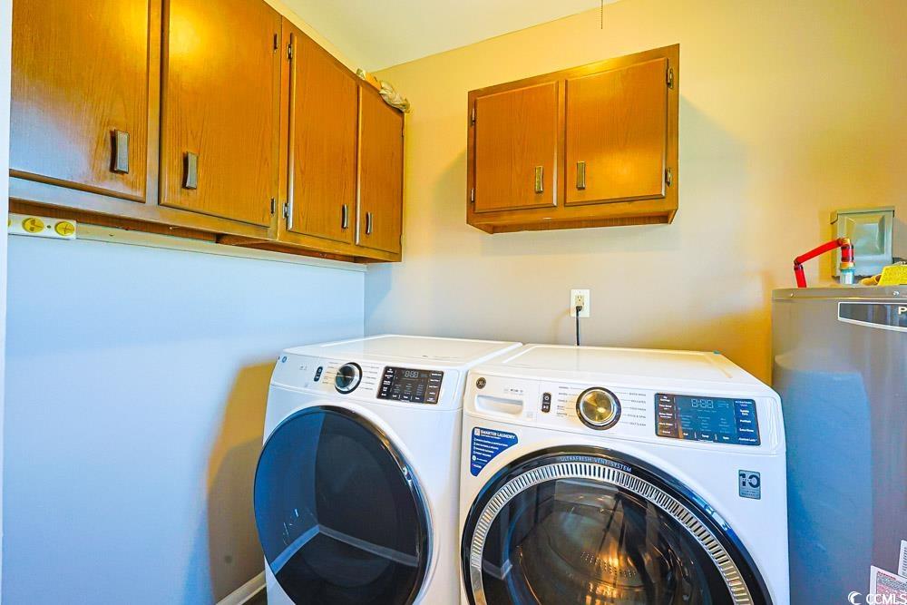 200 Math Place Little River, SC 29566 - Photo 11 of 40 Laundry area featuring water heater, separate washer and dryer, and cabinet space