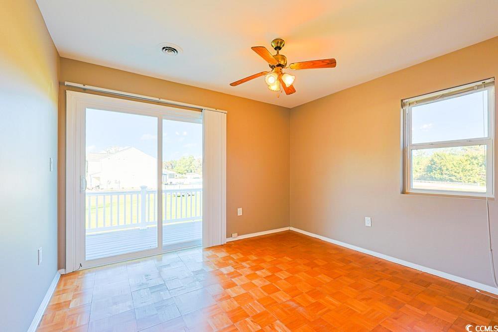 200 Math Place Little River, SC 29566 - Photo 12 of 40 Empty room featuring baseboards and ceiling fan
