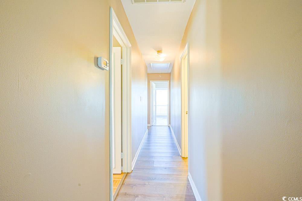 200 Math Place Little River, SC 29566 - Photo 16 of 40 Corridor with light wood-style flooring and attic access