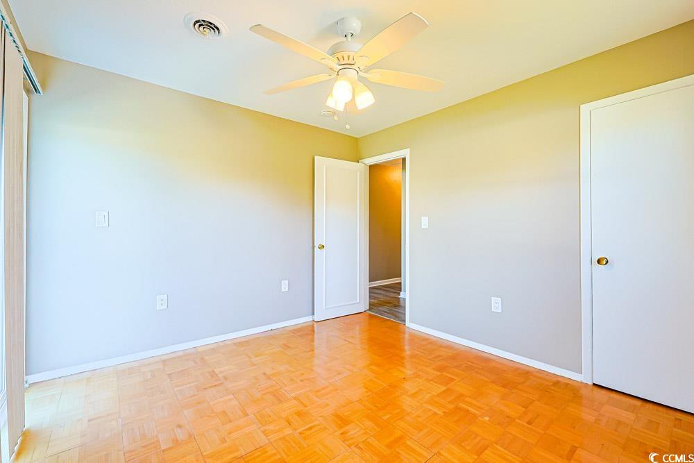 200 Math Place Little River, SC 29566 - Photo 18 of 40 Unfurnished bedroom featuring baseboards and a ceiling fan