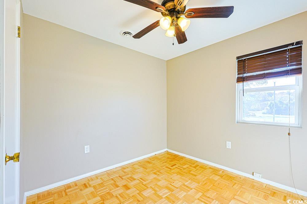 200 Math Place Little River, SC 29566 - Photo 24 of 40 Empty room with baseboards and a ceiling fan