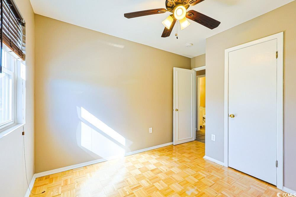 200 Math Place Little River, SC 29566 - Photo 26 of 40 Unfurnished bedroom with baseboards and a ceiling fan