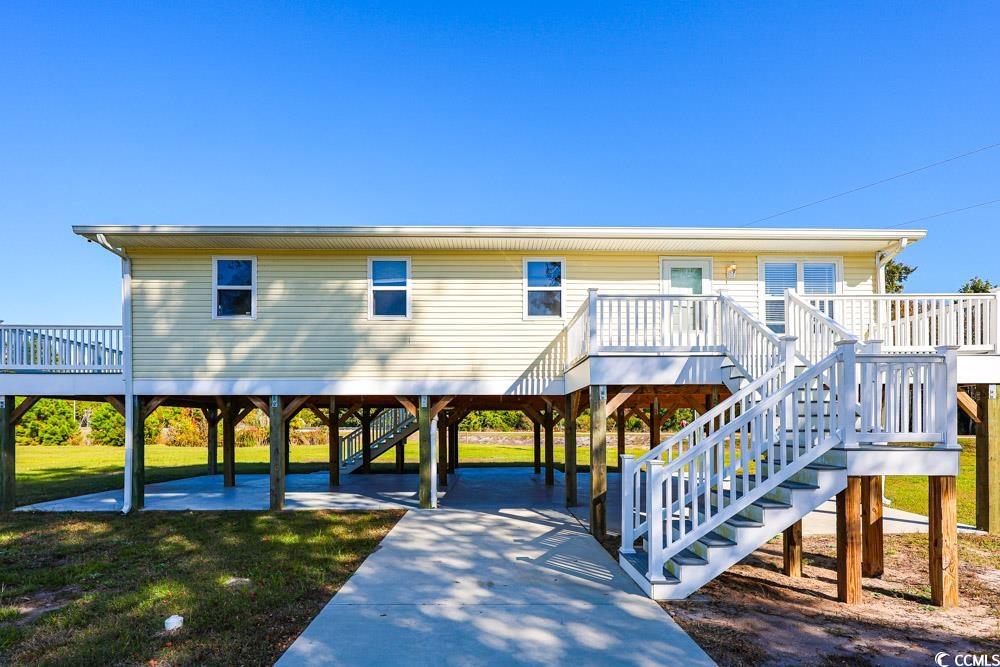 200 Math Place Little River, SC 29566 - Photo 32 of 40 Back of property with a deck, stairs, and a yard