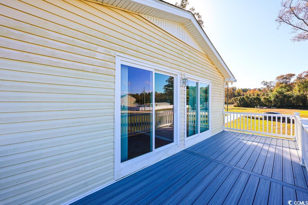 200 Math Place Little River, SC 29566 - Photo 38 of 40 Wooden deck featuring a lawn