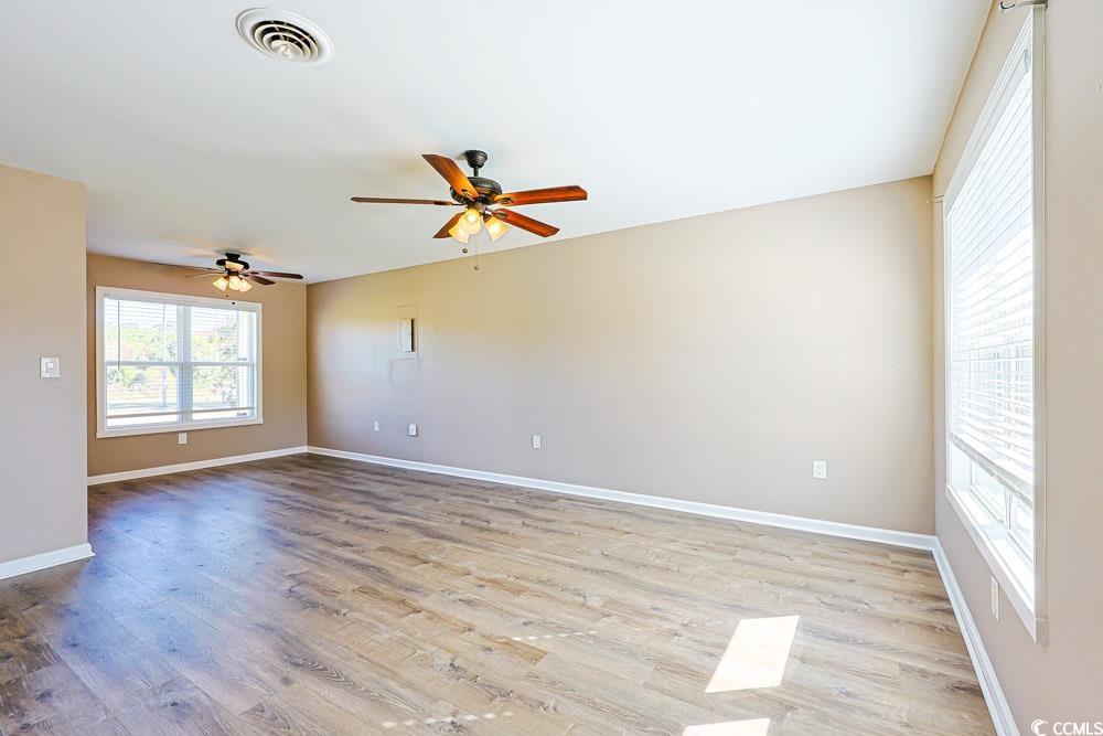 200 Math Place Little River, SC 29566 - Photo 5 of 40 Spare room with light wood-style floors and ceiling fan