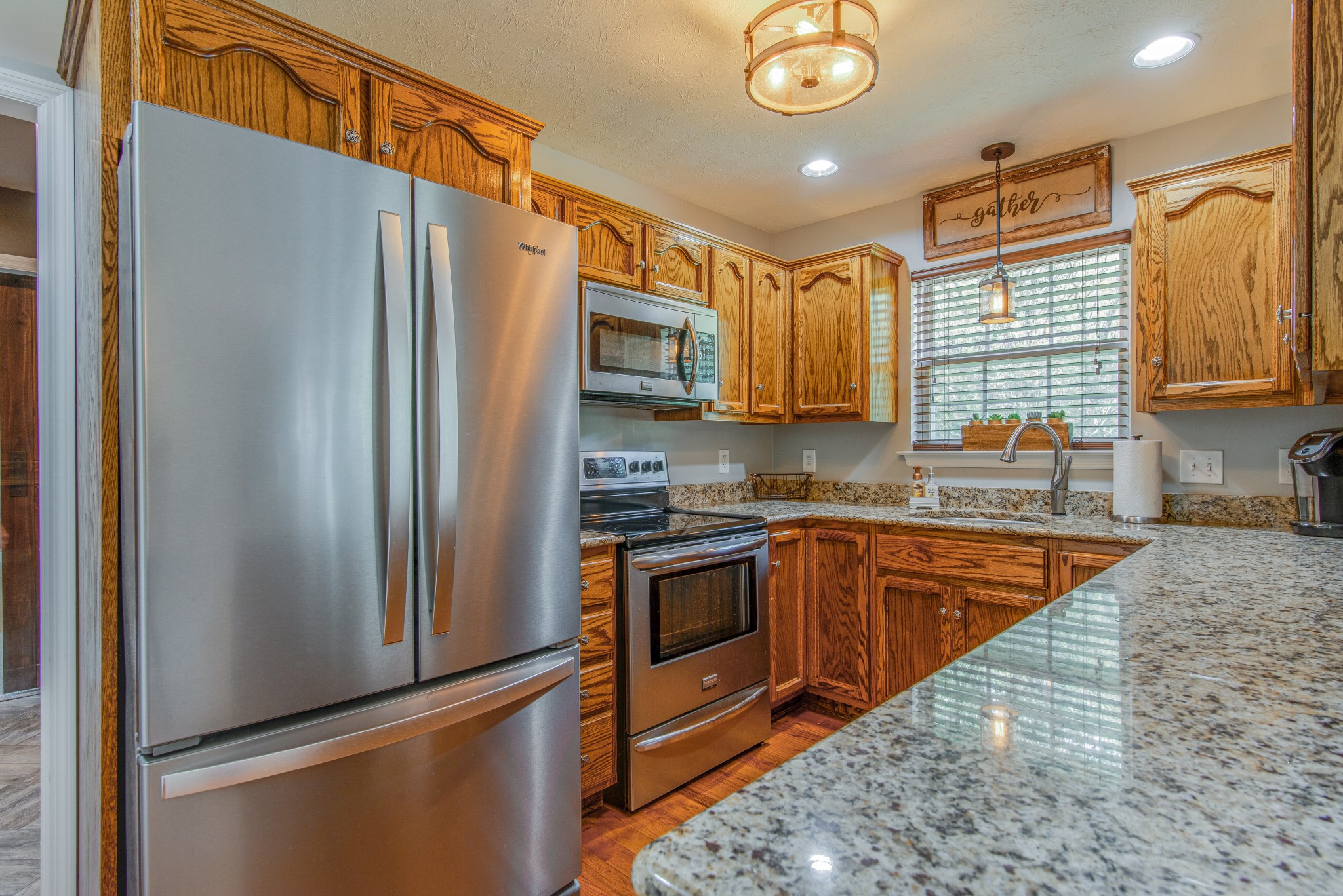 2696 Oak Grove Road Lebanon, TN 37090 - Photo 12 of 34 a kitchen with stainless steel appliances granite countertop a refrigerator a stove and a sink