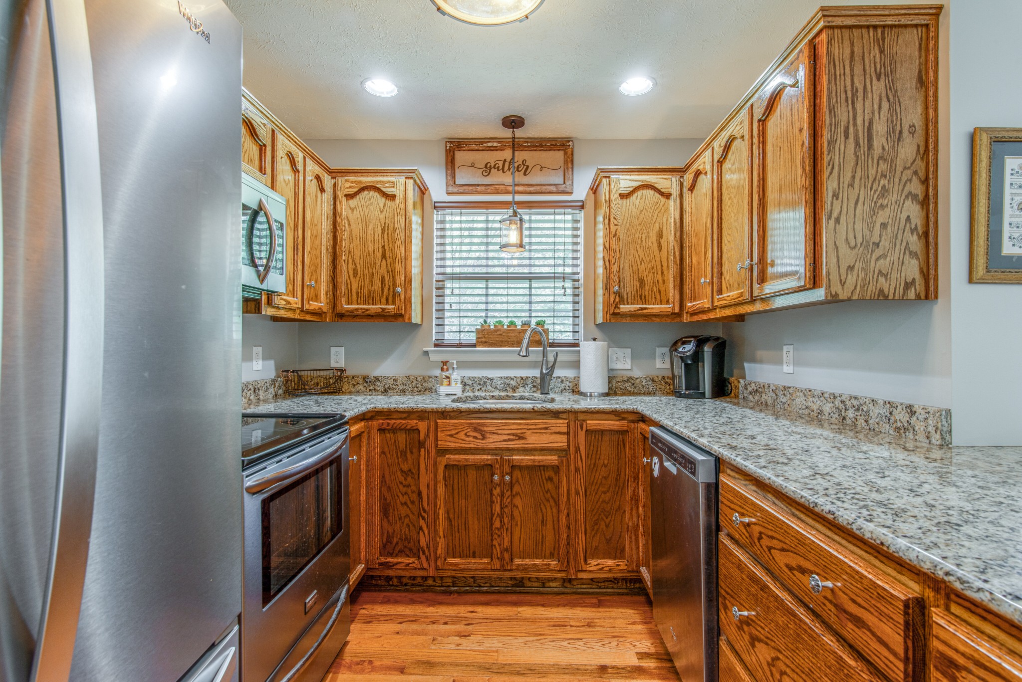 2696 Oak Grove Road Lebanon, TN 37090 - Photo 13 of 34 a kitchen with stainless steel appliances granite countertop a sink stove and cabinets