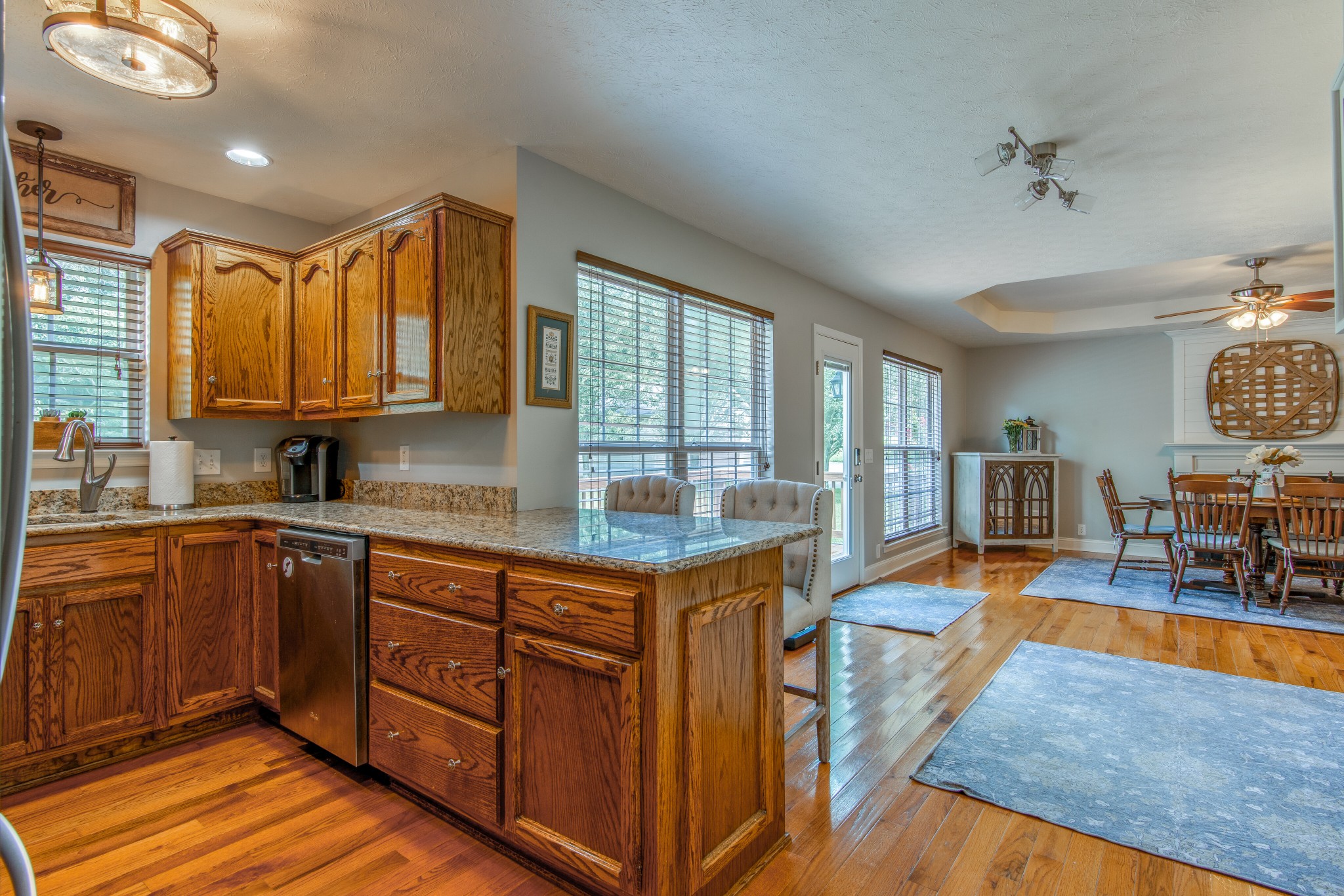 2696 Oak Grove Road Lebanon, TN 37090 - Photo 14 of 34 a kitchen with stainless steel appliances granite countertop sink stove and wooden cabinets