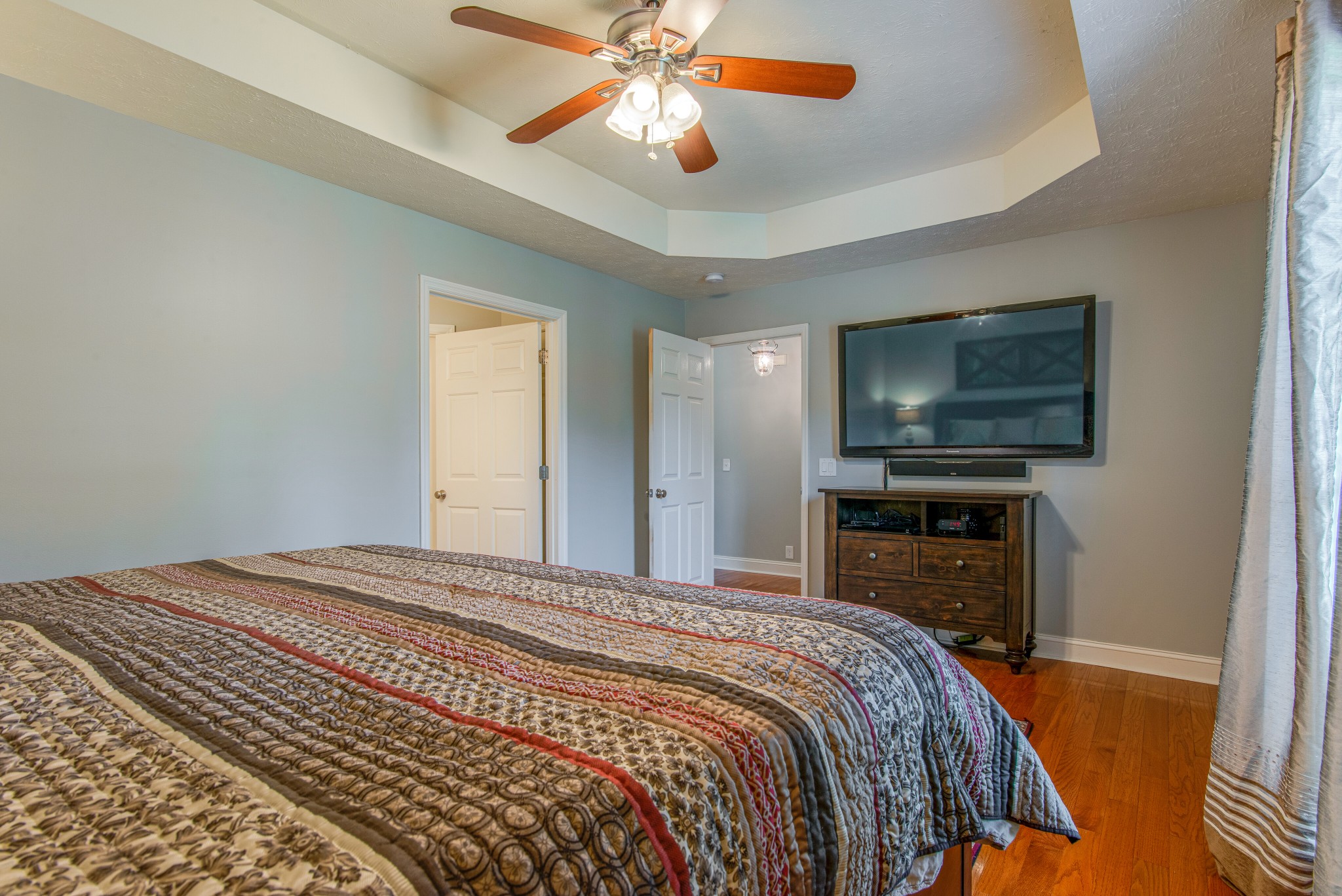 2696 Oak Grove Road Lebanon, TN 37090 - Photo 17 of 34 a bedroom with a bed and a flat screen tv