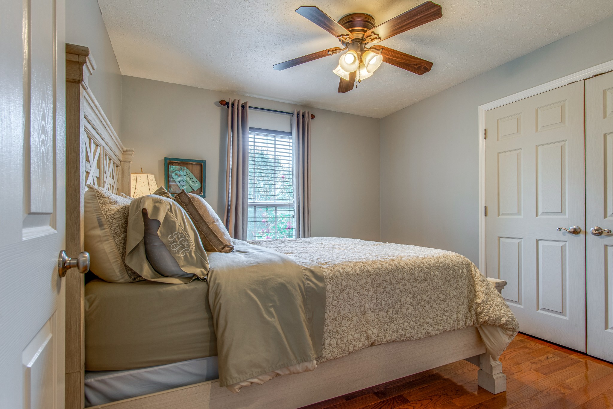 2696 Oak Grove Road Lebanon, TN 37090 - Photo 20 of 34 a bedroom with a bed and a chandelier