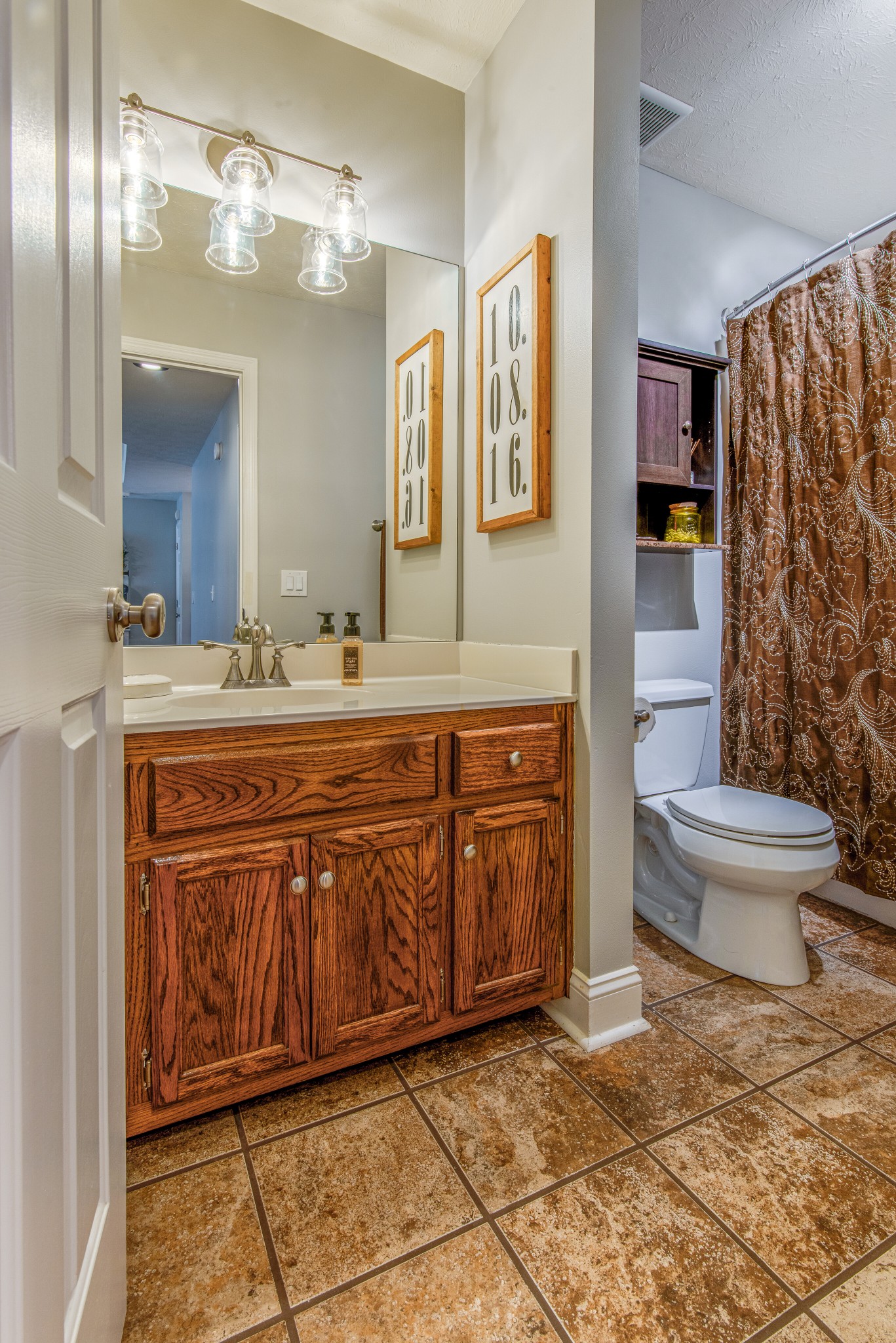 2696 Oak Grove Road Lebanon, TN 37090 - Photo 24 of 34 a spacious bathroom with a granite countertop sink and a mirror