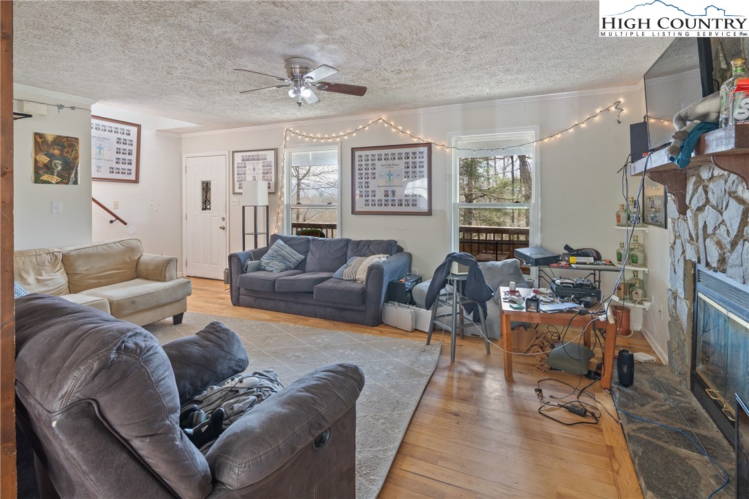 656 Winterberry Trail Boone, NC 28607 - Photo 13 of 47 a living room with furniture and a window