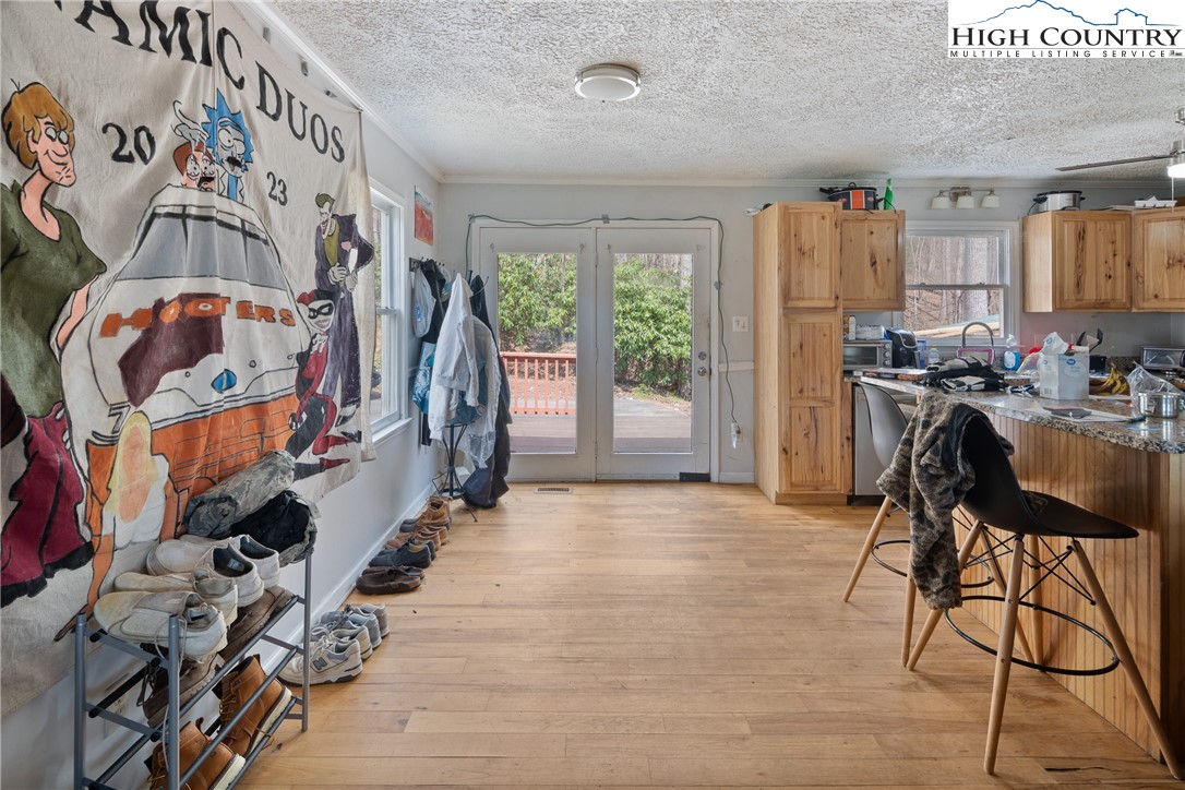 656 Winterberry Trail Boone, NC 28607 - Photo 14 of 47 a view of a livingroom with furniture hardwood floor and a flat screen tv