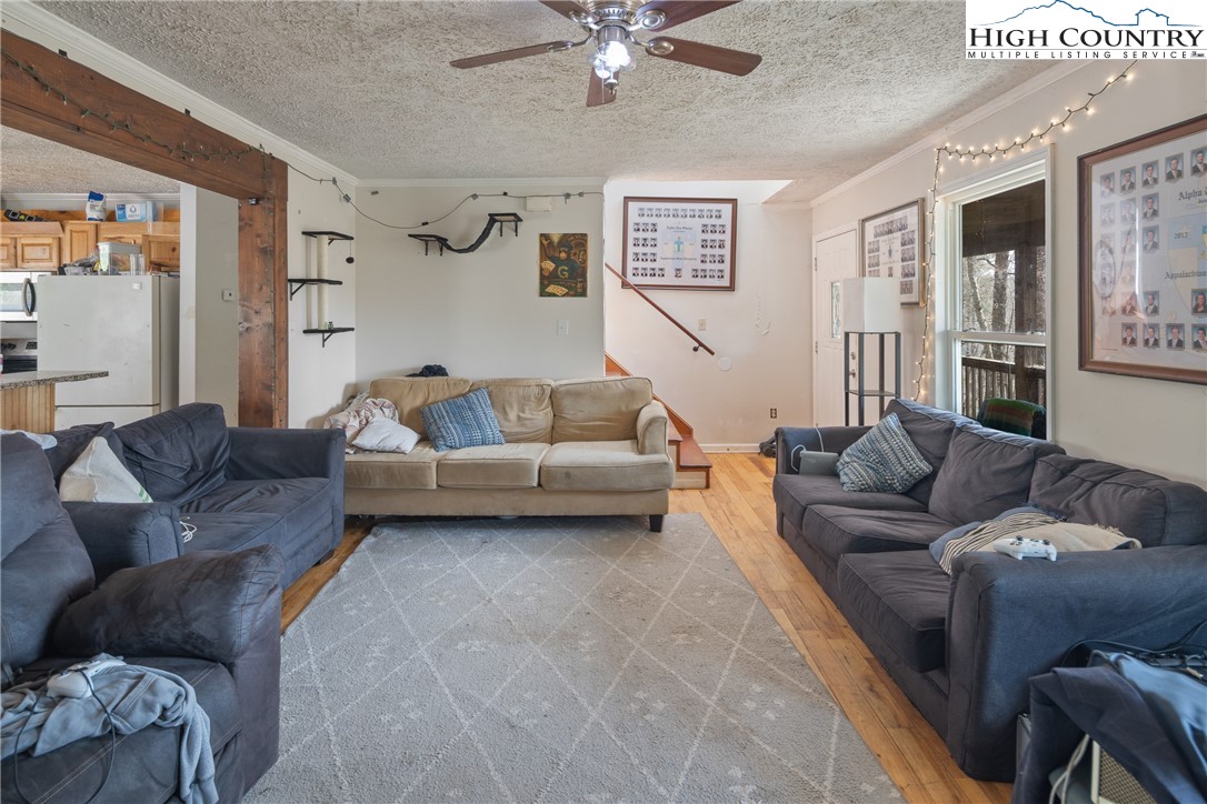 656 Winterberry Trail Boone, NC 28607 - Photo 17 of 47 a living room with furniture and a couch