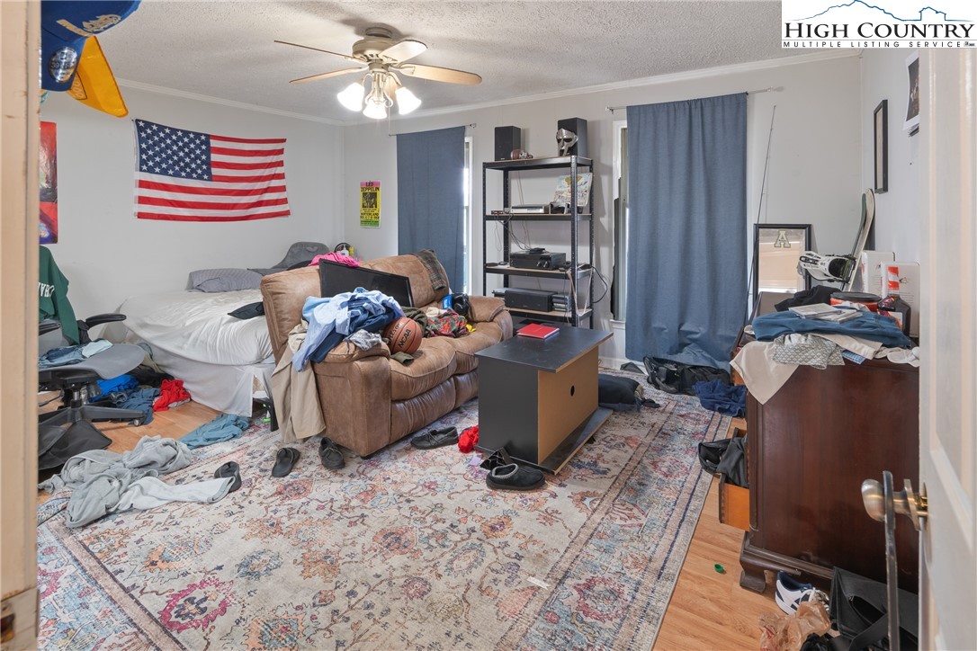 656 Winterberry Trail Boone, NC 28607 - Photo 19 of 47 a bedroom with a bed and cabinets