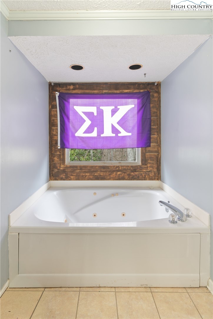656 Winterberry Trail Boone, NC 28607 - Photo 22 of 47 a bathroom with a sink and mirror