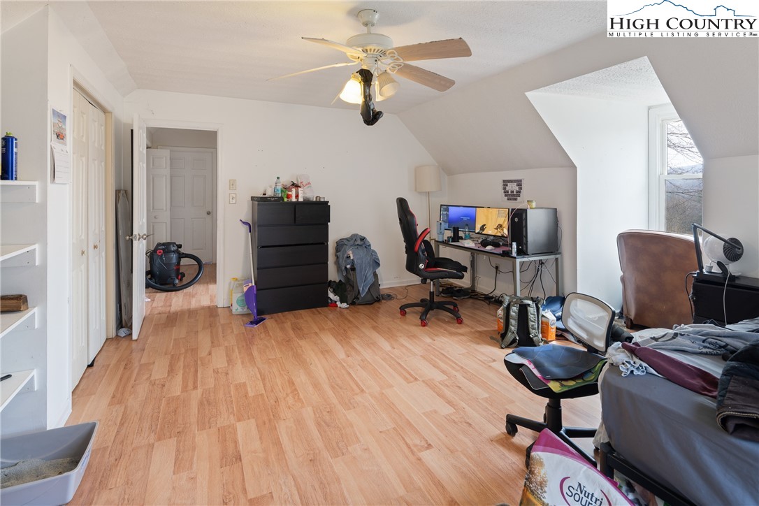 656 Winterberry Trail Boone, NC 28607 - Photo 24 of 47 a bedroom with furniture and a wooden floor